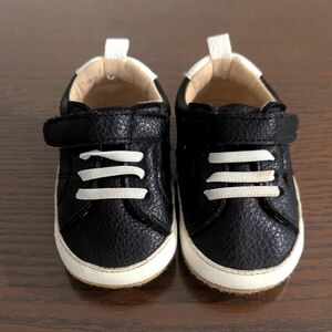 Black and white faux leather baby shoes